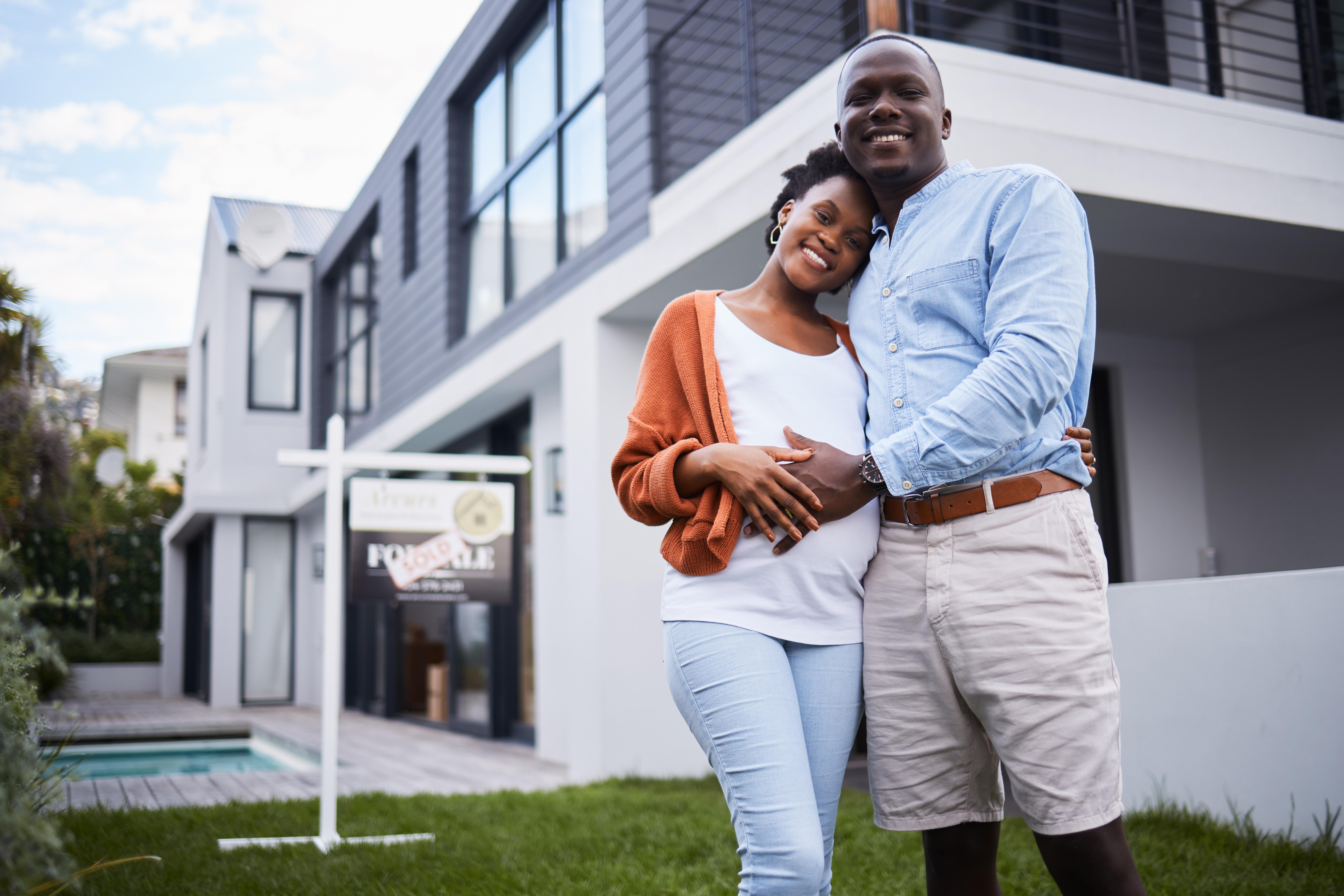portrait-of-a-young-couple-standing-outside-their-2026-01-09-09-10-28-utc